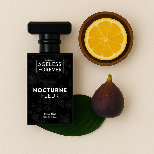 Black glass spray bottle labeled Nocturne Fleur beside floral accents; luxury room mist with skin-safe botanical fragrance