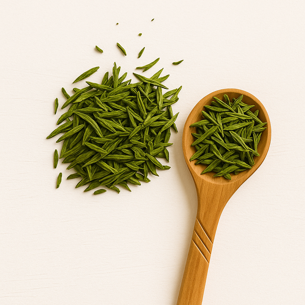 Cup of bright green sencha tea with loose leaves on a ceramic tray; Japanese green tea rich in EGCG for skin protection and antioxidant defense
