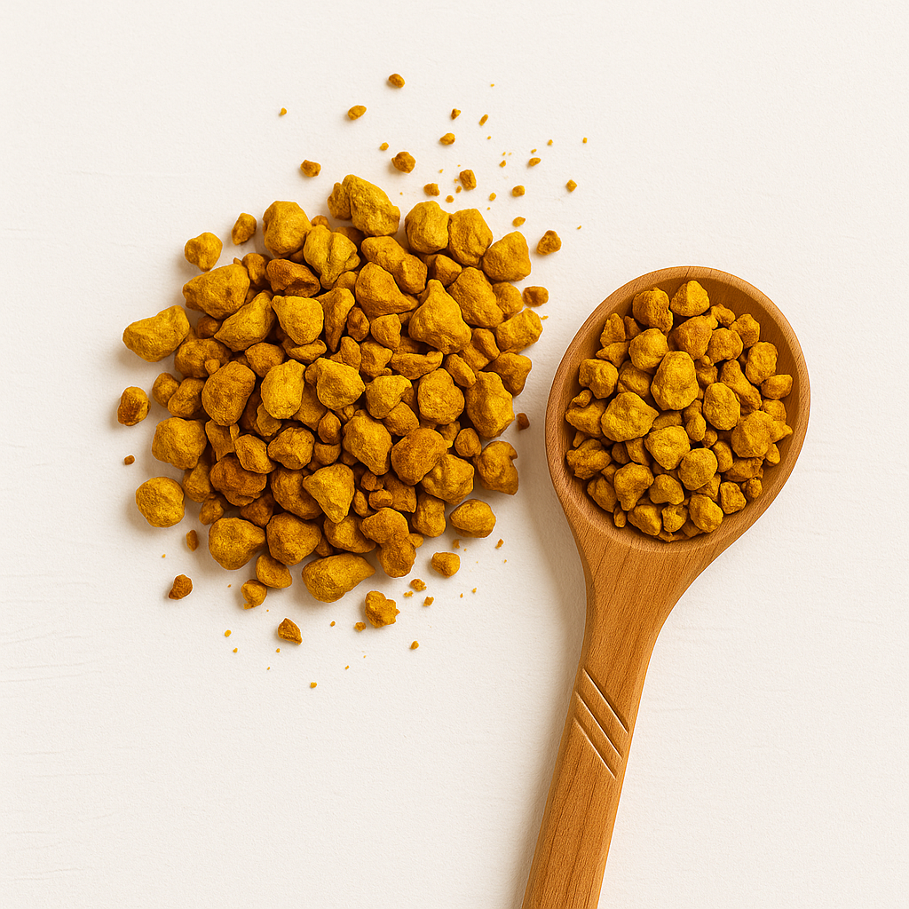 Golden-hued cup of turmeric and ginger tea with scattered roots; anti-inflammatory tea for radiant, calm skin