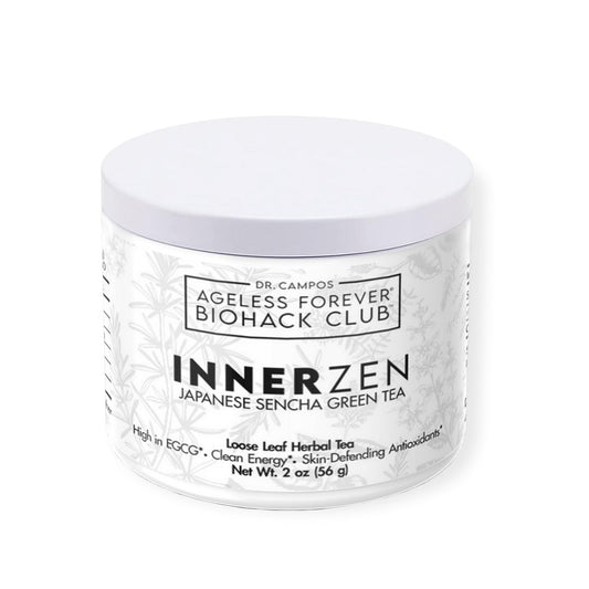 Cup of bright green sencha tea with loose leaves on a ceramic tray; Japanese green tea rich in EGCG for skin protection and antioxidant defense